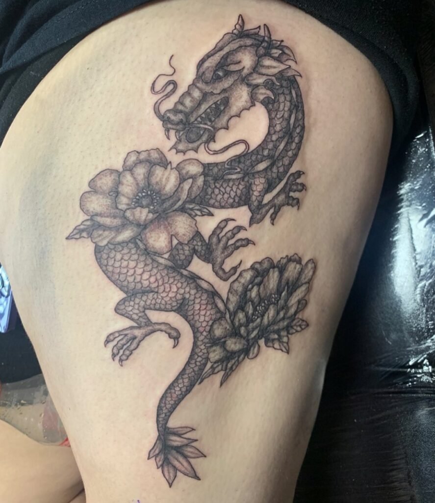 Dragon women's thigh tattoos