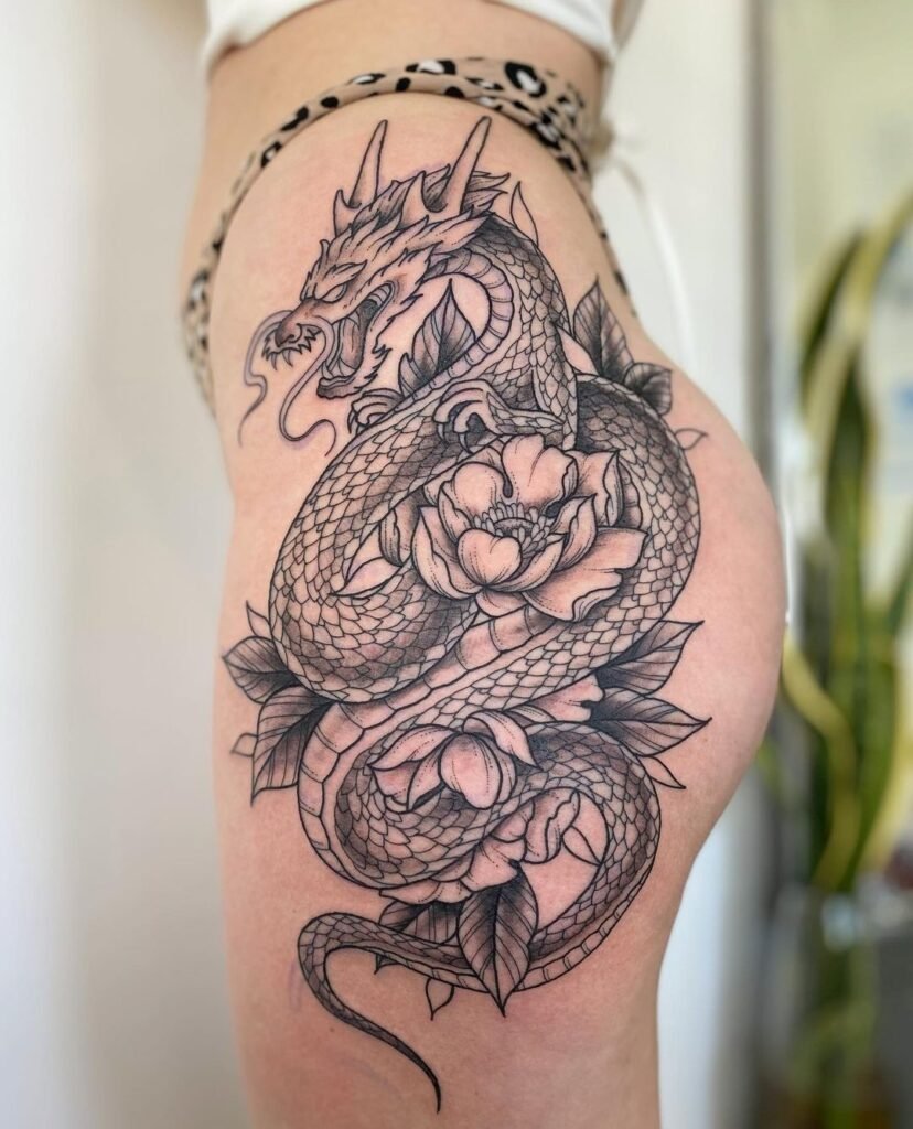 Snakes women's thigh tattoos