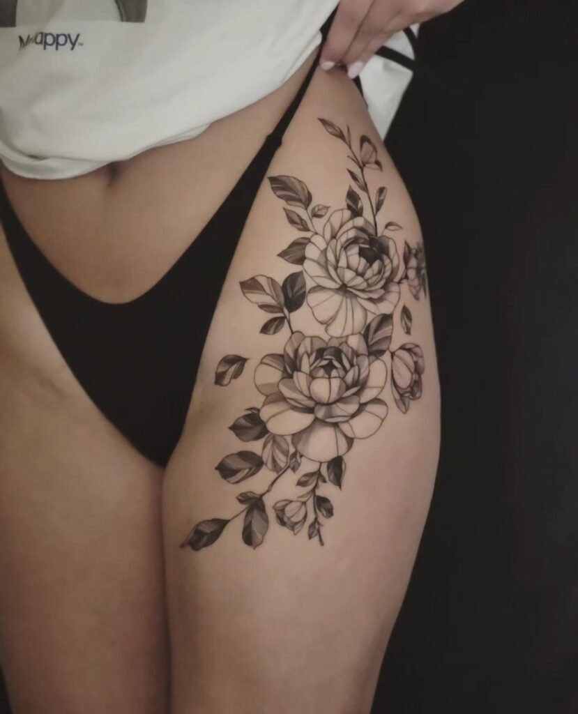 Women's thigh flower tattoos
